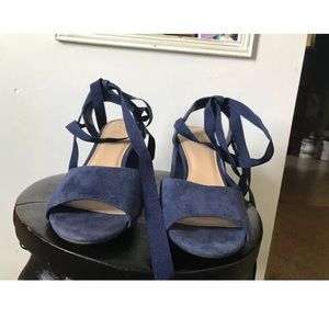 Blue wrap heeled sandals by Guess
